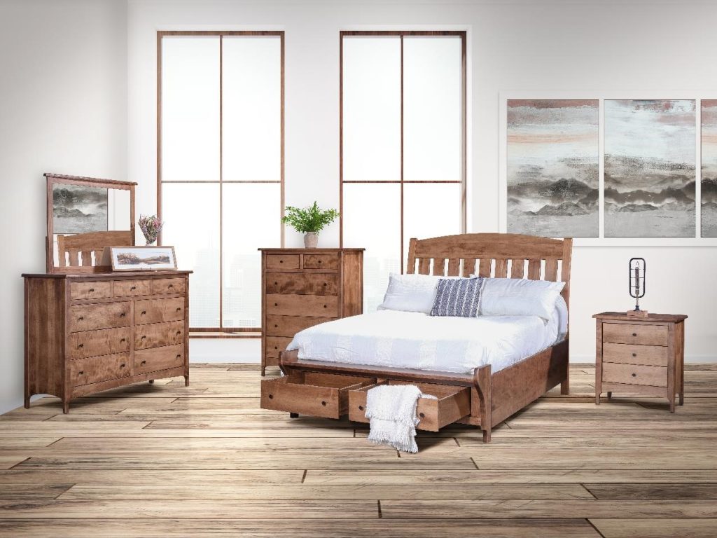 Buena Vista bedroom set shown in a room scene. Shown with the queen bed with footboard storage, a 3 drawer nightstand, 6 drawer chest, and 9 drawer dresser with the mirror.